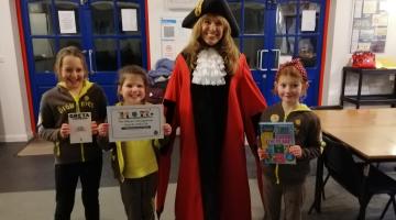 The Mayor with three children holding certificates
