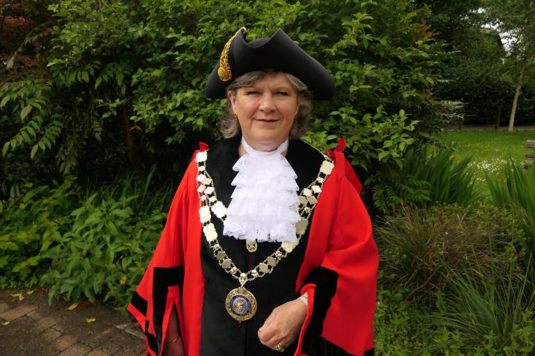 A photo of councillors Debo Sellis, the new mayor of West Devon, dressed in the West Devon mayoral regalia.