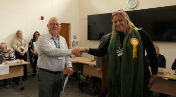 A photo of Steve Mullineaux, Returning Officer for West Devon, with new borough councillor Cllr Holly Greenberry-Pullen.