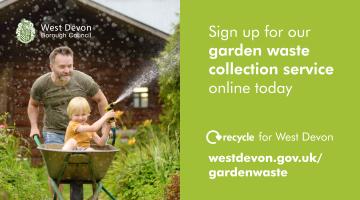 A photo of a man pushing his child around a garden in a wheelbarrow. The child is spraying water from a hose on plants in the garden. The image also includes the council logo and the text sign up for our garden waste collection service online today.